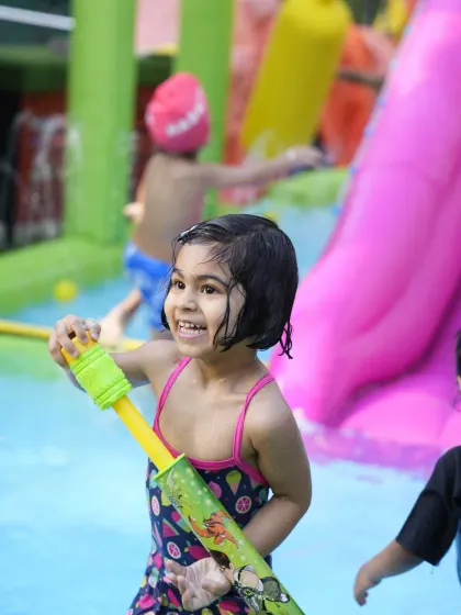 Making a splash! Our summer pool parties are the perfect way to cool down, with water guns, slides, and endless fun for our happiest visitors.