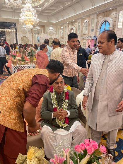 Sharing a moment with the guest of honor at the Gattani family event. Connecting with the families I perform for makes the experience even more special.