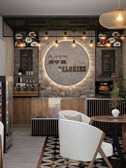 The cafe's counter area is the focal point, with a circular logo and menu boards set against a stone-textured wall. The design is clean, modern, and on-brand.