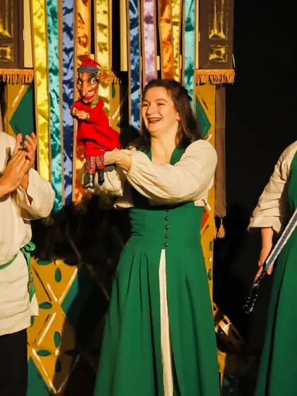 The full cast of 'Petrushka' celebrates their performance, showcasing the blend of live music, acting, and traditional Russian hand puppetry.