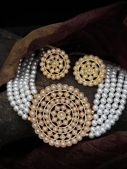 Our lifestyle jewellery photography places your pieces in an elegant, natural setting, capturing the texture of the pearls and the warm tones of the gold to create an aspirational image.
