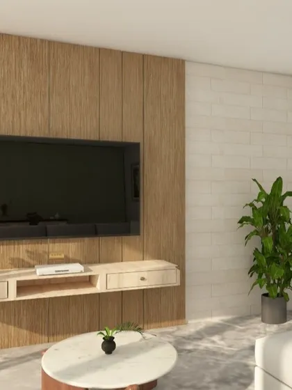A living room design featuring a TV wall with a combination of louvers, veneer panels, and a brick texture. The floating console keeps the look clean.