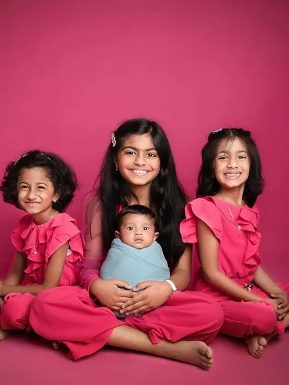 The most adorable siblings I have had the pleasure of shooting. The coordinated outfits and bright smiles make this a truly special family portrait.