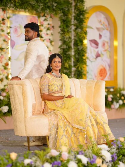 Abhinaya looking regal on her reception stage. Her makeup is designed to be photogenic and long-lasting, ensuring she looks perfect throughout the evening's celebrations.