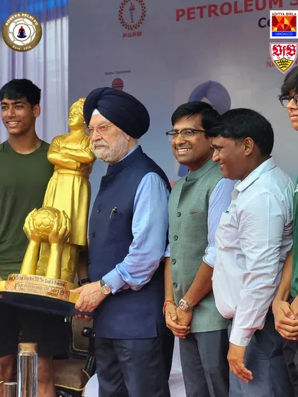 Honorable minister Hardeep Singh Puri holding a trophy at our National Sports Day event. We are proud to host dignitaries who share our vision for sports in India.