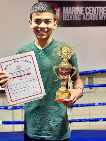 A close-up of our young champion Himanshu Dudhade with his certificate of merit and trophy.
