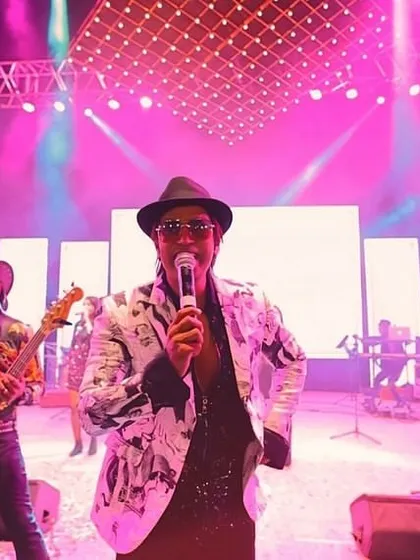 My full band and I owning the stage. From the guitarist to the bassist, we work together to create a powerful wall of sound that gets everyone moving.