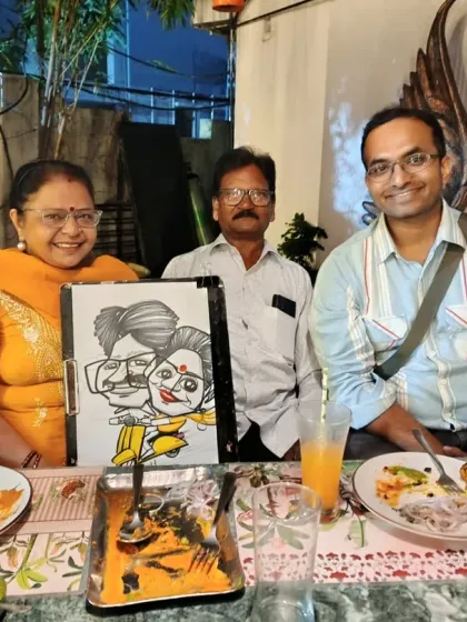 A family enjoying their time together and getting a group caricature. It's a fun activity that brings everyone together for a laugh.