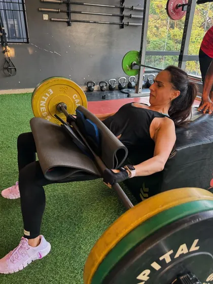 Building powerful glutes is essential for overall strength and stability. This client is performing a heavy barbell hip thrust, a key exercise in my programs for developing lower body power and a strong posterior chain.