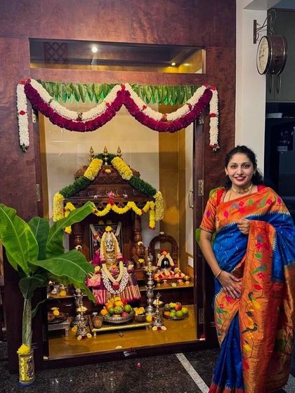 A full view of the festive decor and our client in her exquisite Paithani saree, a perfect choice for celebrating the festival of lights.