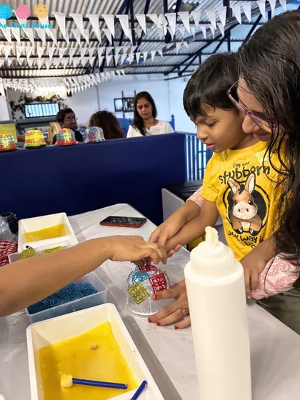 A mother and child getting creative together at a workshop. We provide the perfect setup for hands-on activities and learning experiences.