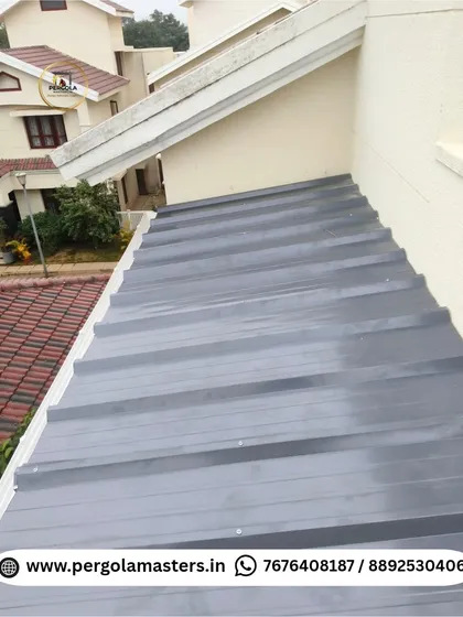 The exterior view of a newly installed puff sheet roof. The corrugated metal surface is durable and designed to efficiently manage rainwater, providing a long-lasting, low-maintenance roofing solution.