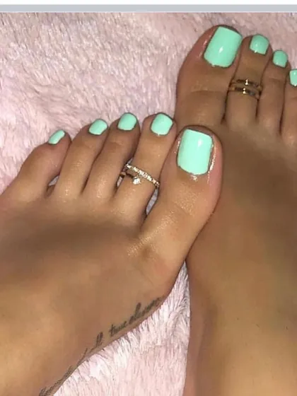 A fun and bright mint green pedicure. This color is perfect for summer and adds a fun pop to any look.