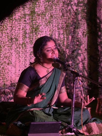 A beautiful, softly lit photo from my performance at Namma Ashram, capturing a moment of deep immersion in the music.
