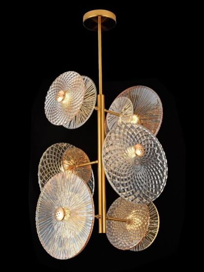 A multi-light pendant with fluted glass discs. This fixture is perfect for adding a touch of art deco glamour to a living room or dining area.