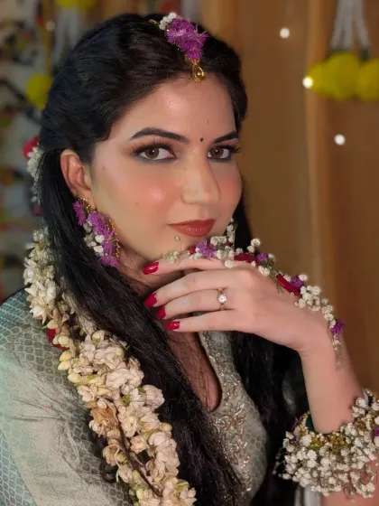A Haldi ceremony is all about fun and radiance. For this look, I used a pop of green kajal to add a playful touch, paired with glowing skin and floral jewelry. The makeup is designed to be long lasting and picture perfect through all the festivities.