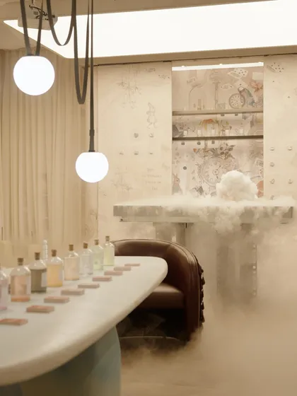 We love adding a touch of drama to our experiential designs. Here, a cloud of smoke adds a layer of mystery and magic to our Mad Hatter's Tea Party installation. This detail, combined with custom lighting and unique furniture, creates an unforgettable, immersive brand experience for visitors.