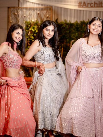 The bride and her bridesmaids posing in their gorgeous sangeet outfits. They don't just dance well, they look amazing doing it.