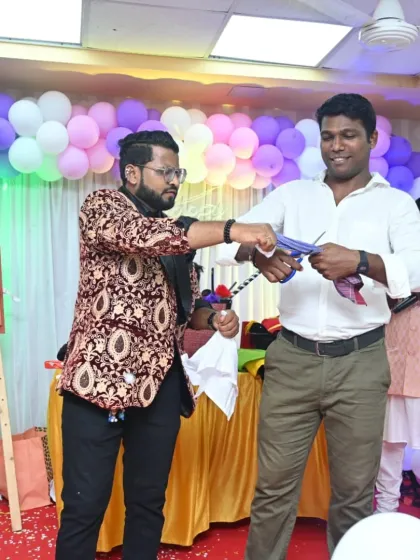 A guest from the audience helps me with a colorful cutting and restoring trick. My shows are filled with these opportunities for your guests to experience the magic up close.