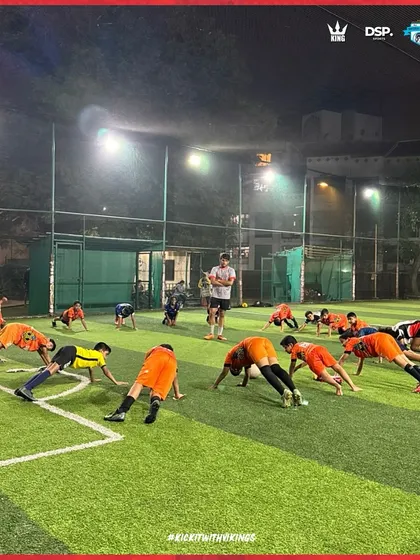 The whole squad in sync. A conditioning drill under the floodlights, building the fitness required to dominate for 90 minutes.