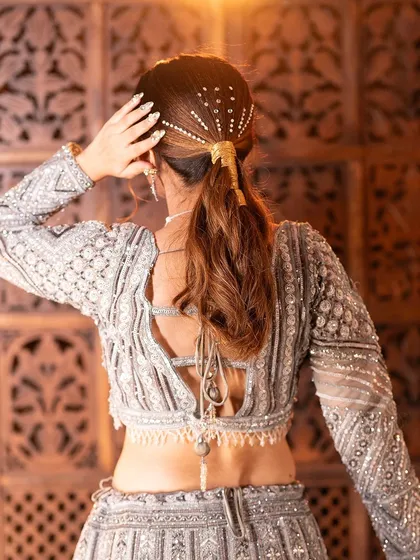 A complete look at my silver-grey geometric lehenga from a professional shoot. You can see the intricate details, the stylish back, and how it moves. It's a true work of art.