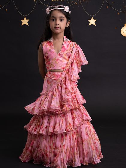 A beautiful floral lehenga set, showcasing our ability to work with delicate prints and create layered looks.