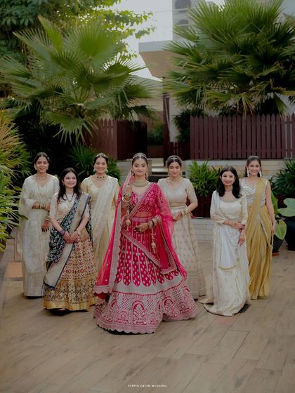 A beautiful portrait of the bride with her elegantly dressed bridesmaids, a lovely memory of her bride tribe.
