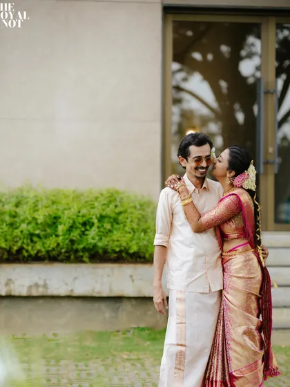 A sweet moment captured after the wedding. The bride's saree remains perfectly pleated, a testament to my meticulous draping technique.
