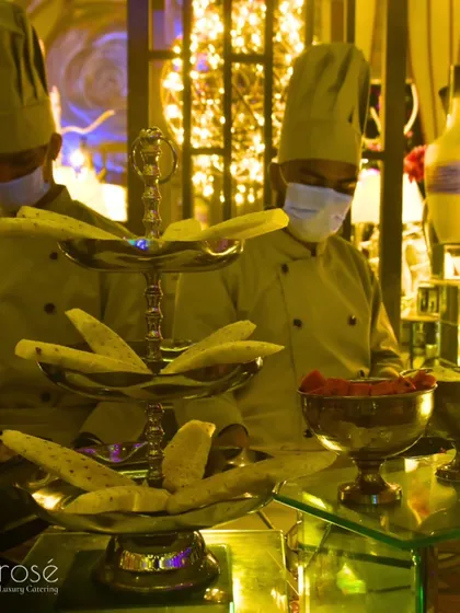 Our chefs at work behind a beautifully arranged buffet. Even in a busy service, our team maintains professionalism and hygiene, ensuring perfection from beginning to end.