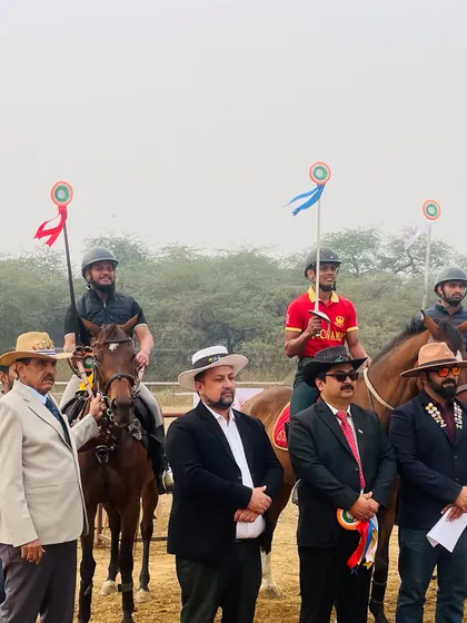 Our riders mounted on their horses, standing with officials during a victory ceremony. This level of formal recognition is what we train our students to achieve.