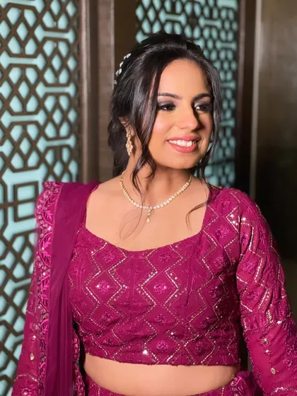 A portrait of the happy Sangeet client.