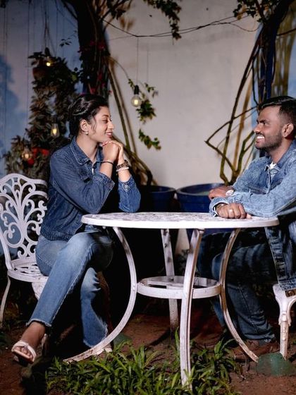 A casual night-time scene at a cafe-style table, with soft lighting creating a relaxed and intimate mood.