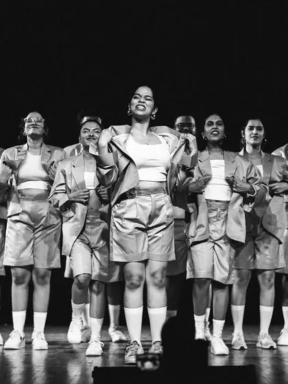 A powerful pose from one of our performance groups, captured in timeless black and white. This image showcases the grace and strength of our dancers.