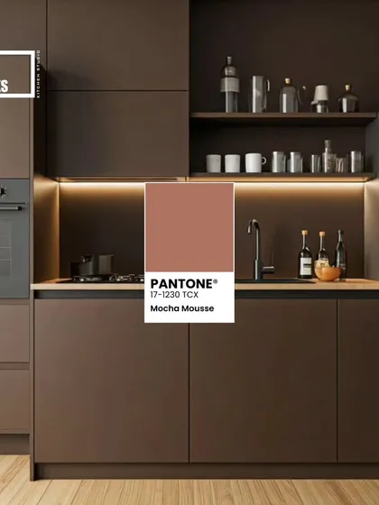 A modern, minimalist kitchen using a dark Mocha Mousse for handleless cabinets, creating a sleek and contemporary vibe.
