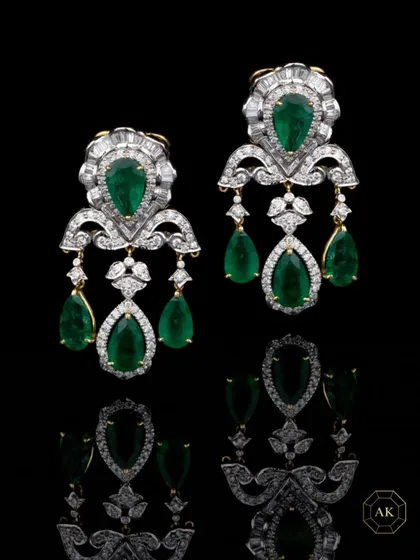 A statement jewel is your voice, your aura, your story. These emerald and diamond chandelier earrings are crafted for women who command a room without saying a word.