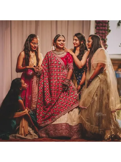 A bride surrounded by her best friends. These are the unscripted, joyful moments with loved ones that become some of the most cherished memories from a wedding day.
