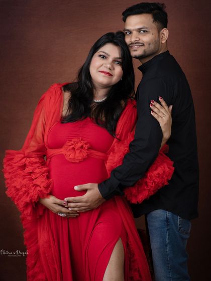 A happy and relaxed portrait of the couple. Their easy smiles and comfortable embrace show their excitement for the journey ahead.
