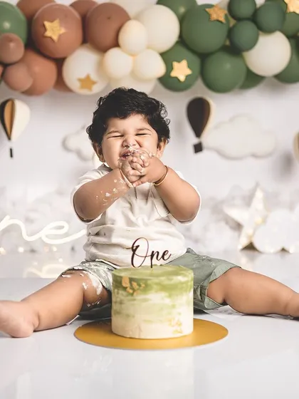 The best part of a cake smash is getting to eat the cake! This little guy is enjoying every bite.
