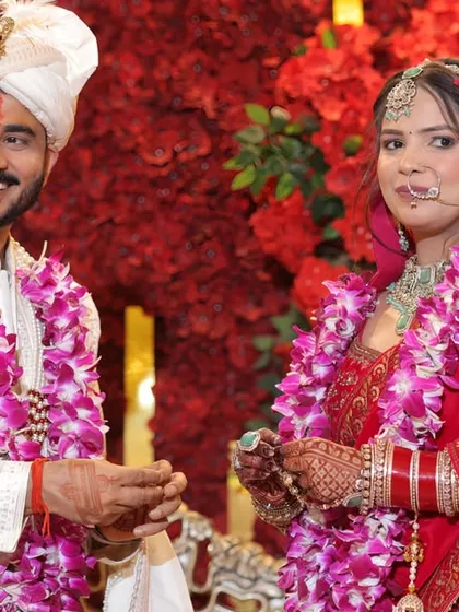 A happy, classic portrait of the couple after their Varmala ceremony. Their smiles show the joy of the moment, a perfect memory to be framed.