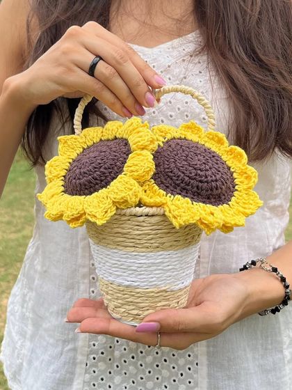 Our handmade crochet sunflower basket, perfect for adding a touch of sunshine to your desk or as a wall hanging.
