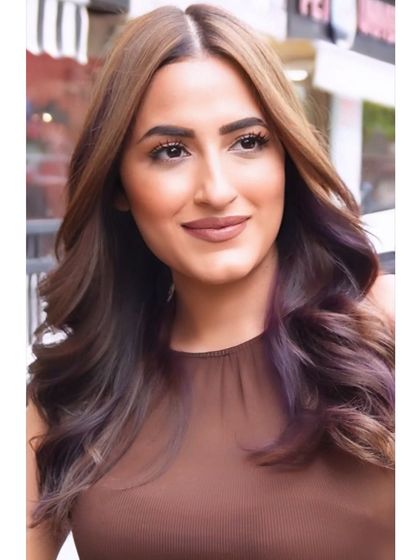 Another shot of the client's stunning new look. The soft waves and beautiful color melt create a truly photo-worthy result.