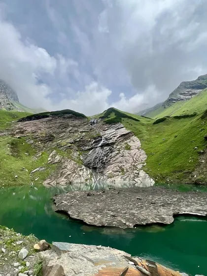 A closer look at the sacred Beas Kund lake. It's a place where myth and nature come together, surrounded by glaciers and towering peaks.