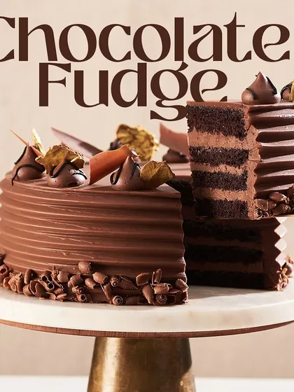 A full view of my Chocolate Fudge Cake, showcasing the textured frosting and carefully placed chocolate decorations on top. It's a classic choice for any celebration.