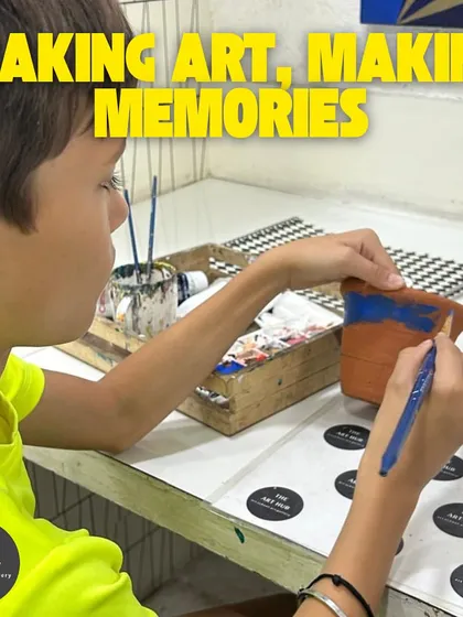 Making art is about making memories. Here, a young boy is enjoying a craft session, painting a terracotta pot and learning about color and texture.