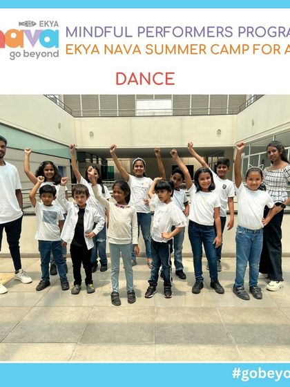 A group of children strikes a powerful pose at the end of their dance class. Dance is a key part of my Mindful Performers Program, helping children build confidence, express emotions, and develop coordination.