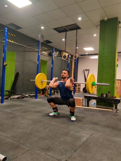 A person becomes great not by birth, but by their actions. A front squat, a foundational movement for building strength and stability.