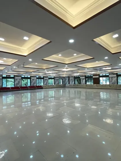 Another shot of the spacious, empty hall in Nerul, highlighting the clean, reflective flooring and the ample room available for any kind of event setup.
