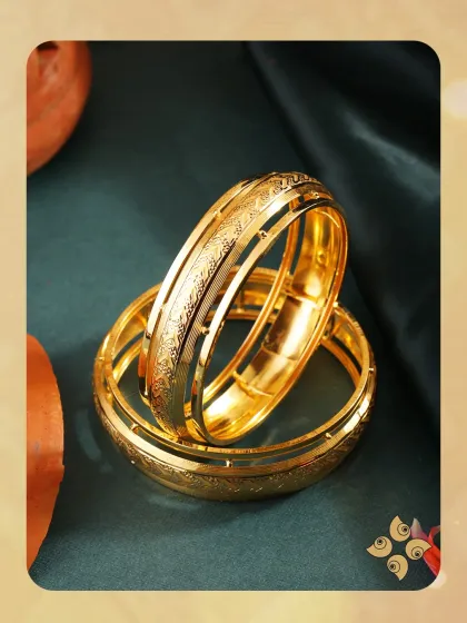 Our collection of classic gold bangles is a staple for any jewellery retailer. This image displays a pair of meticulously crafted broad kadas with detailed etching, representing the timeless appeal and high-volume potential of our bangle inventory.