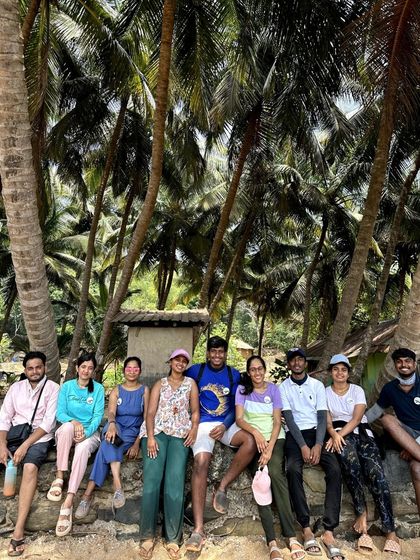 Posing under the shade of coconut trees on a beautiful Gokarna beach.