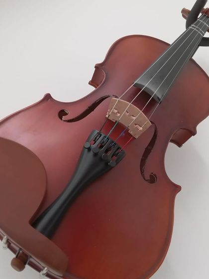 A close-up of a violin, one of the many instruments we teach at our school.